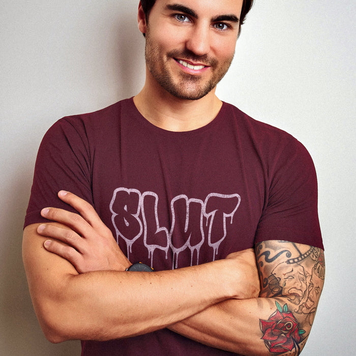 PRODUCT IMAGE: Cum Slut | Raunchy Tees for Horny Gay Men Who Love Cum | Model wears Maroon shirt