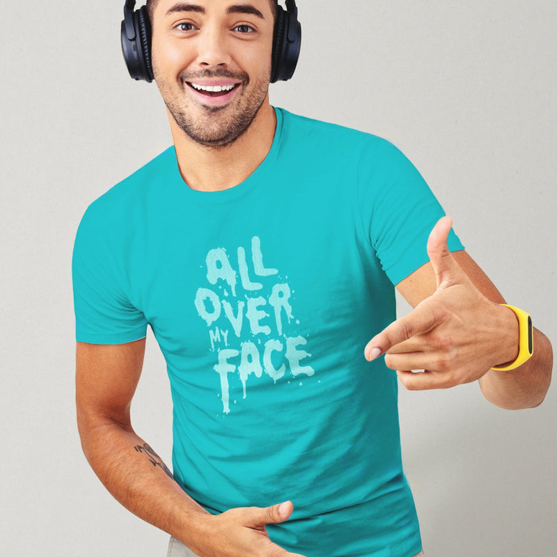 PRODUCT IMAGE: All Over My Face T-shirt | Raunchy Tees for Horny Gay Guys who Love Cum | Model wears Turquoise shirt with a typographic design