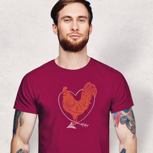 PRODUCT IMAGE: I Love Cock | SFW Raunchy T-shirt for Horny Gay Guys who Love Cock | Model wears Maroon shirt with rooster and heart graphic 