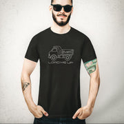 Load Me Up T-shirt | Raunchy T-shirt for Horny Gay Bottom Guys Who Crave Cum | Model wears Black shirt with white line drawing of a dump truck