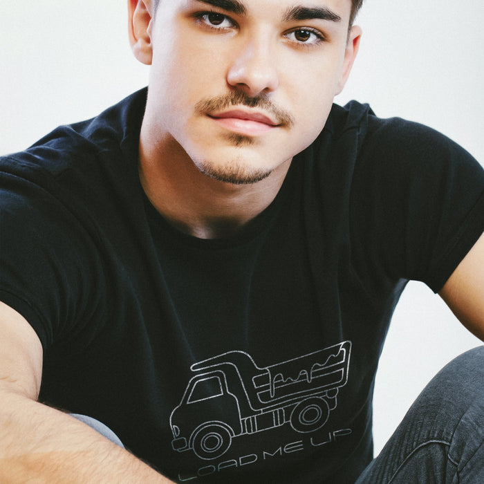 Load Me Up T-shirt | Raunchy T-shirt for Horny Gay Bottom Guys Who Crave Cum | Model wears Black shirt with white line drawing of a dump truck