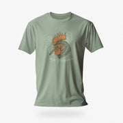 PRODUCT IMAGE: Smokin’ Cock Tee  | Funny, Raunchy T-shirt for Horny Gay Men | Sage shirt with a vintage-style graphic of a rooster smoking a cigar