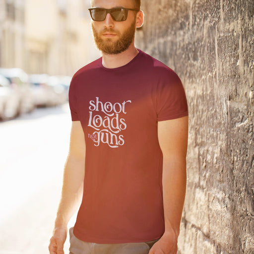 PRODUCT IMAGE: Model wears Aqua tee with typographic design, "Shoot Loads Not Guns" | Conscious and Raunchy T-shirt for Guys into Cum