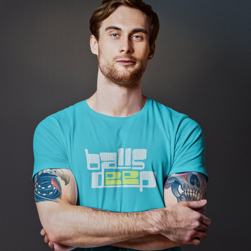 PRODUCT IMAGE: Balls Deep | Raunchy Tee for Horny Gay Guys who Like it Deeper | Model wears Typographic design on Turquoise shirt