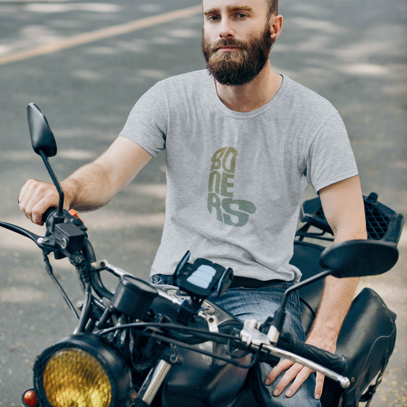 PRODUCT IMAGE: Boners | NSFW Tee | Typographic Design in the form of Cock and Balls | Male model on mototrcycle wears light gray heather shirt