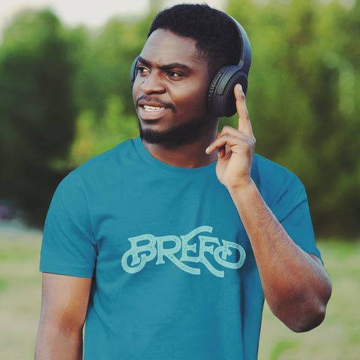 PRODUCT IMAGE: Breed T-shirt | Raunchy Tees for Horny Gay Guys Who Bareback, Love Cum | Model wears typographic design on Aqua shirt