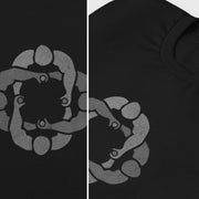 Diptych close-p details of black cotton t-shirt with subtle circle graphic of seated male figures holding hands (Circle Jerks), viewed from above; gay-themed design for bators and group play