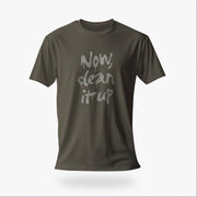 Product image of the Army color t-shirt with "Now, clean it up" printed on the chest; the  milky white letterforms drip, lending to an appropriate interpretation