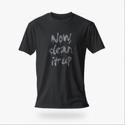 Product image of a dark gray t-shirt with "Now, clean it up" printed on the chest; the  milky white letterforms drip, lending to an appropriate interpretation