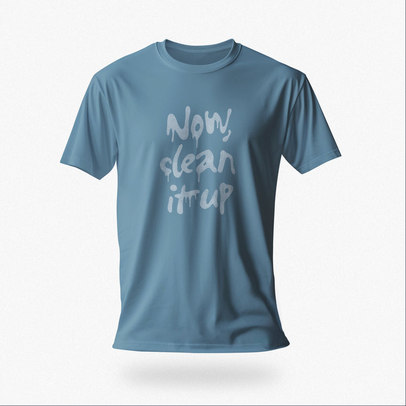 Product image of a steel blue t-shirt with "Now, clean it up" printed on the chest; the  milky white letterforms drip, lending to an appropriate interpretation