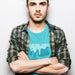 PRODUCT IMAGE: Dumpster T-shirt | Raunchy Tees for Horny Gay Guys Who Take Loads | Model wears Turquoise shirt with a typographic design featuring white dripping liquid referring to a man's cum