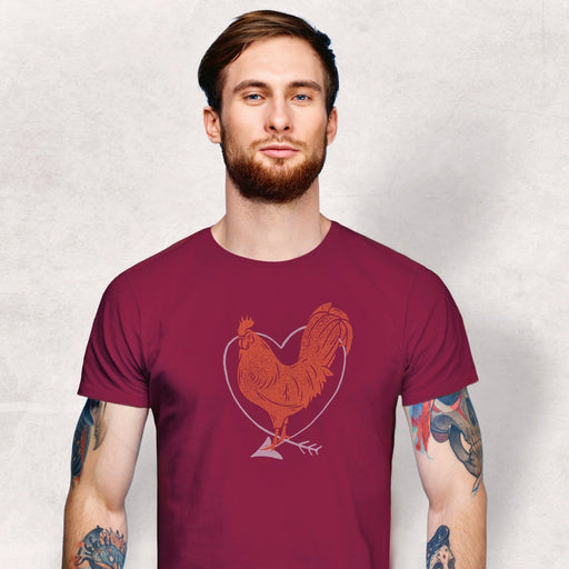 PRODUCT IMAGE: I Love Cock | SFW Raunchy T-shirt for Horny Gay Guys who Love Cock | Model wears Maroon shirt with rooster and heart graphic 