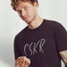 PRODUCT IMAGE | CSKR T-shirt from Pole & Hole | The texting (or sexting) abbreviation for cocksucker | Model w/ Dark Gray Heather Shirt