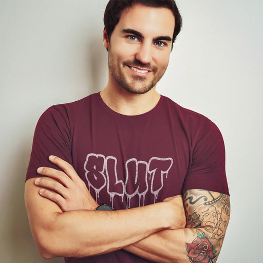 PRODUCT IMAGE: Cum Slut T-shirt | Raunchy Tees for Horny Gay Men Who Love Cum | Model wears Maroon shirt