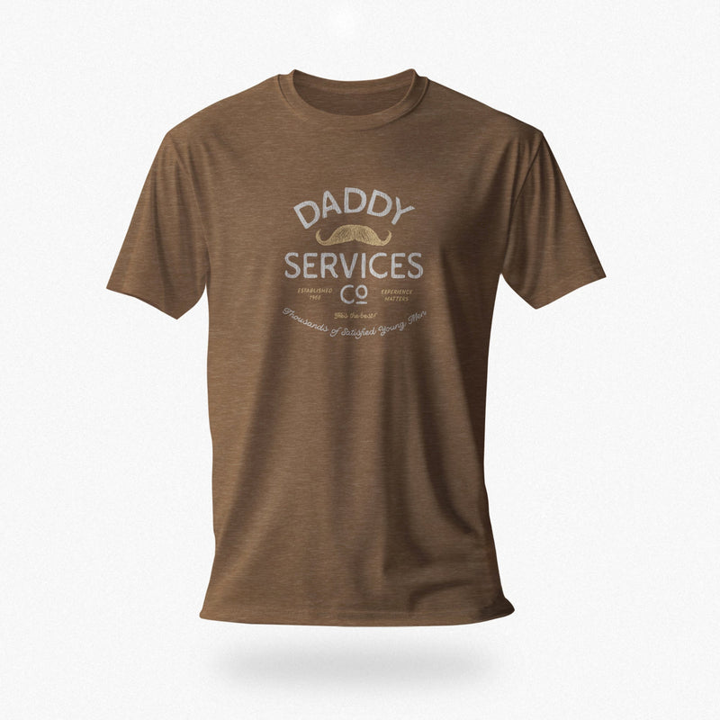 A brown heather short-sleeve crewneck t-shirt with a vintage-style graphic on the chest reading 'DADDY SERVICES CO' with a small mustache illustration, shown against a light gray background.