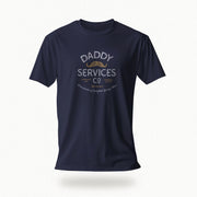 A navy blue short-sleeve t-shirt with a vintage-style graphic on the chest reading 'DADDY SERVICES CO' in distressed white and gold lettering, shown against a light gray background with a soft drop shadow.