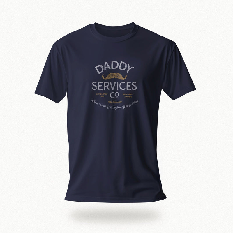A navy blue short-sleeve t-shirt with a vintage-style graphic on the chest reading 'DADDY SERVICES CO' in distressed white and gold lettering, shown against a light gray background with a soft drop shadow.