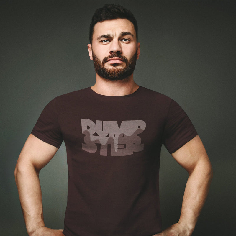PRODUCT IMAGE: Dumpster T-shirt | Raunchy Tees for Horny Gay Guys Who Take Loads | Model wears Oxblood shirt with a typographic design featuring white dripping liquid referring to a man's cum