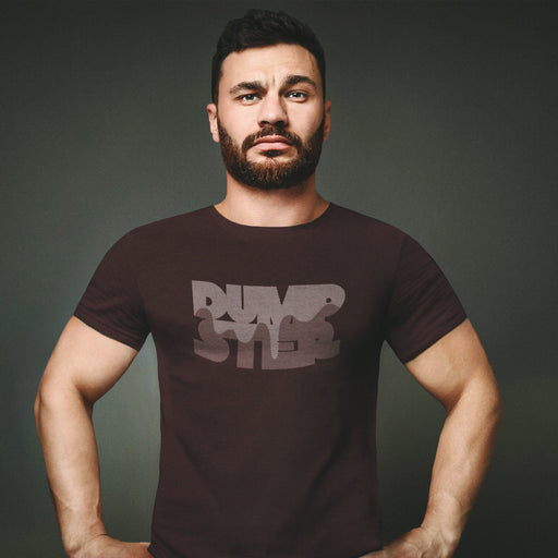 PRODUCT IMAGE: Dumpster T-shirt | Raunchy Tees for Horny Gay Guys Who Take Loads | Model wears Oxblood shirt with a typographic design featuring white dripping liquid referring to a man's cum