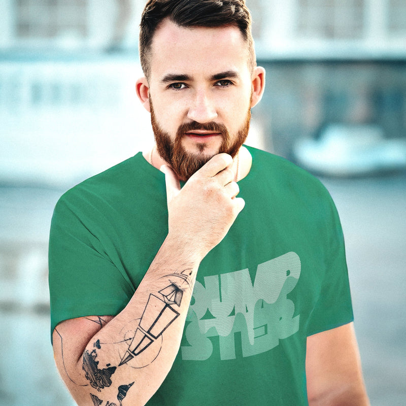 PRODUCT IMAGE: Dumpster T-shirt | Raunchy Tees for Horny Gay Guys Who Take Loads | Model wears Kelly Green shirt with a typographic design featuring white dripping liquid referring to a man's cum