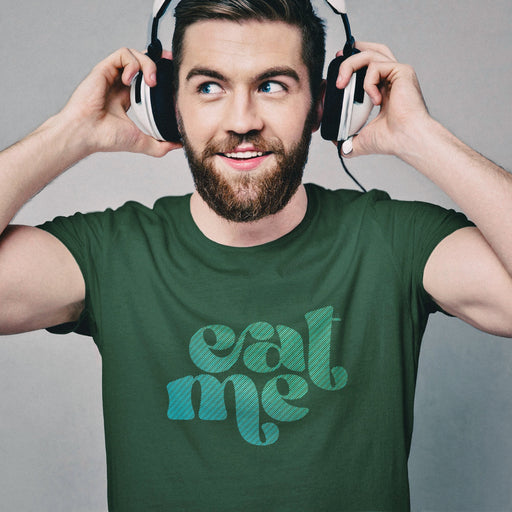 PRODUCT IMAGE: Man wearing headphones and a Forest Green t-shirt with 'Eat Me' graphic | Funny, Raunchy T-shirt for Gay Guys into Oral Sex 