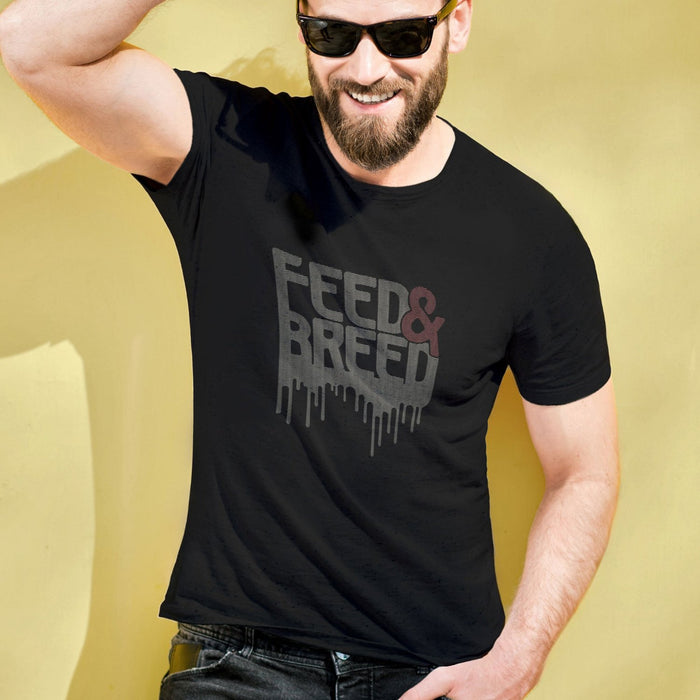 PRODUCT IMAGE: Feed & Breed T-shirt | Raunchy Tees for Horny Gay Guys | Model wears black shirt with typographic design