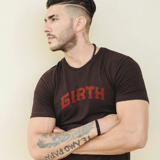 Sexy male model with tattoos wears the "Girth" T-shirt | A slightly arched  typographic design made with patterned letterforms | For Girthy, Gay Bears, DILFs, Muscled Scruffy Daddies (Cubs, Otters, Too) | w/ Thick Cocks + Dicks