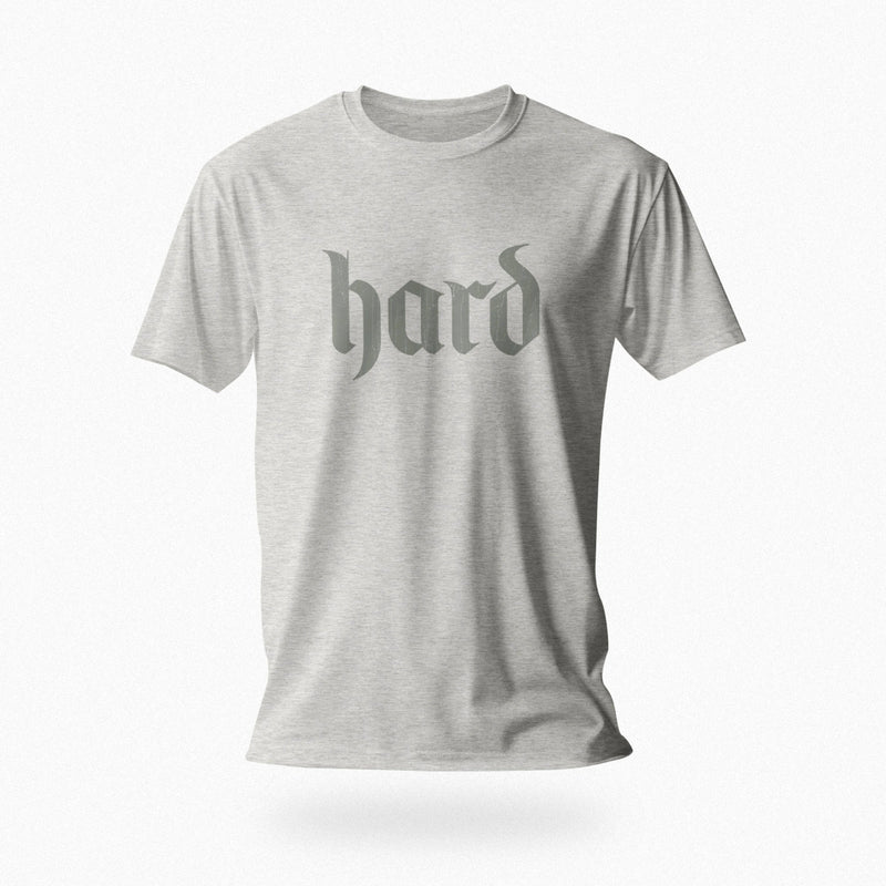 PRODUCT IMAGE: Hard T-Shirt | Raunchy Graphic Tee for Horny Gay Men into big boners, hard cocks, and erections | Light Gray Heather shirt with a design created with blackletter / gothic typography