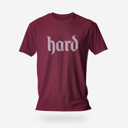 PRODUCT IMAGE: Hard T-Shirt | Raunchy Graphic Tee for Horny Gay Men into big boners, hard cocks, and erections | Maroon shirt with a design created with blackletter / gothic typography