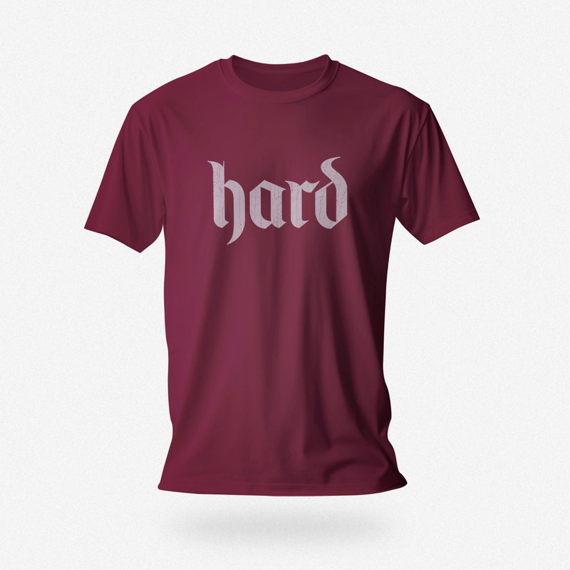 PRODUCT IMAGE: Hard T-Shirt | Raunchy Graphic Tee for Horny Gay Men into big boners, hard cocks, and erections | Maroon shirt with a design created with blackletter / gothic typography