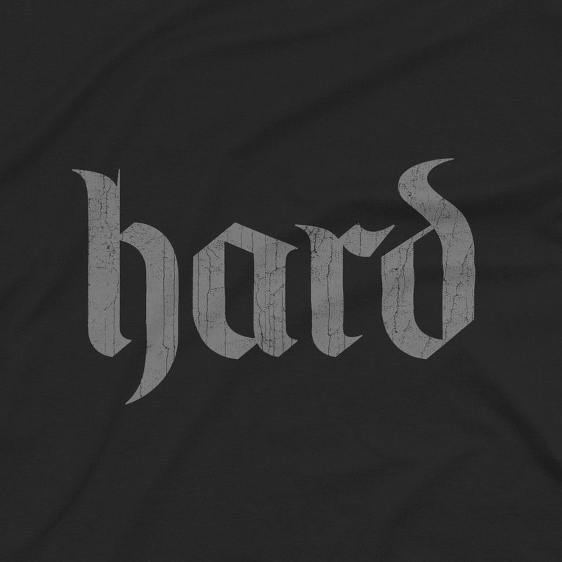 PRODUCT IMAGE: Hard T-Shirt | Raunchy Graphic Tee for Horny Gay Men into big boners, hard cocks, and erections | Close-up of design created with blackletter / gothic typography, printed on Vintage Black short