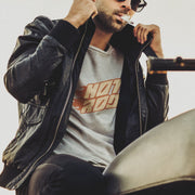 PRODUCT IMAGE: Model wears Light Gray Heather t-shirt featuring vintage flame graphics with classic hot rod styling to a typographic design