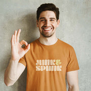 PRODUCT IMAGE: Junk & Spunk T-shirt | Raunchy Tees for Horny Gay Guys | Model wears Orange shirt w/ typographic design