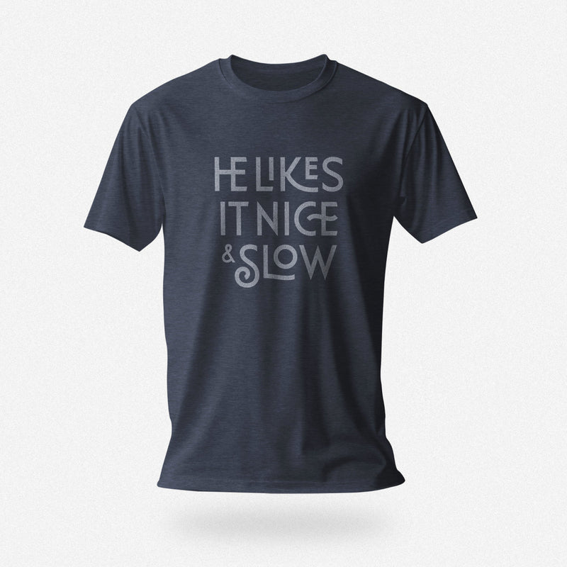 PRODUCT IMAGE: He Likes It Nice & Slow T-shirt | Funny Gay Tee for the guys who take their time and enjoy the ride | Heather Navy shirt with a design borne out of retro-inspired typography