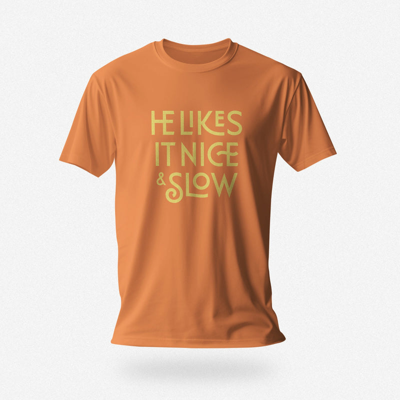 PRODUCT IMAGE: He Likes It Nice & Slow T-shirt | Funny Gay Tee for the guys who take their time and enjoy the ride | Orange shirt with a design borne out of retro-inspired typography