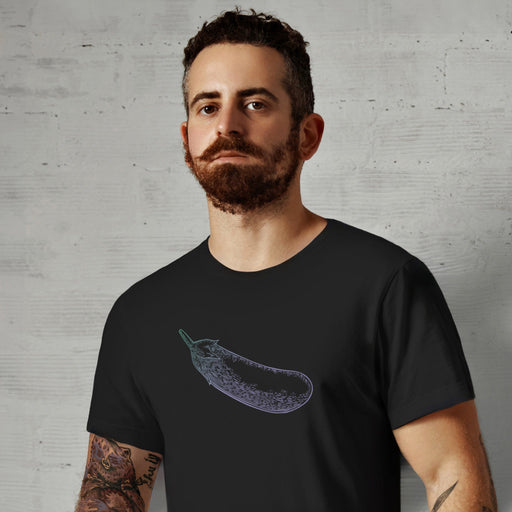 PRODUCT IMAGE: Certified Organic T-shirt | Raunchy Penis T-shirts for Horny Gay Men | Model wears Black shirt with a woodcut-style rendering of the eggplant emoji