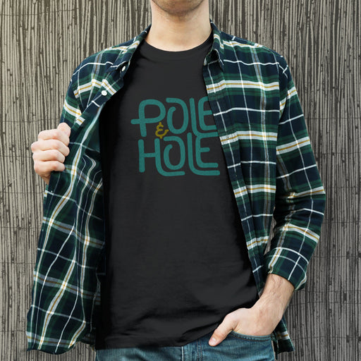 PRODUCT IMAGE: Pole & Hole | SFW, Raunchy Tee for Horny Gay Guys | Model wears Black tee with the shop's typographic trademark 