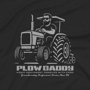 PRODUCT IMAGE: Plow Daddy T-shirt | Raunchy Gay Farmer Tee for Horny Men Who Love Heavy Equipment | Close-up view of the graphic on a Black shirt