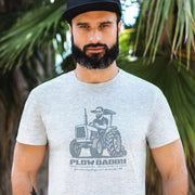 PRODUCT IMAGE: Plow Daddy T-shirt | Raunchy Gay Farmer Tee for Horny Men Who Love Heavy Equipment | Model wears Light Gray Heather shirt