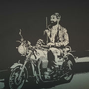 VIDEO for the graphic tee, “Ride It,” which leans fully into vintage biker culture — with a homo wink.