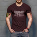 PRODUCT IMAGE: Dumpster T-shirt | Raunchy Tees for Horny Gay Guys Who Take Loads | Model wears Oxblood shirt with a typographic design featuring white dripping liquid referring to a man's cum