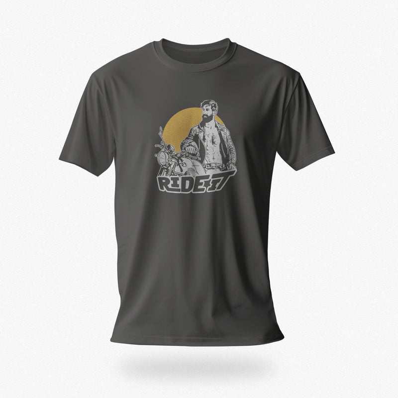PRODUCT IMAGE of an Asphalt t-shirt with a graphic featuring a rugged, bearded biker in a distressed vintage print style with the design's namesake, "Ride It."