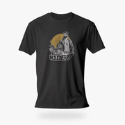 PRODUCT IMAGE of a dark gray t-shirt with a graphic featuring a rugged, bearded biker in a distressed vintage print style with the design's namesake, "Ride It."
