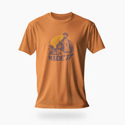 PRODUCT IMAGE of an orange t-shirt with a graphic featuring a rugged, bearded biker in a distressed vintage print style with the design's namesake, "Ride It."