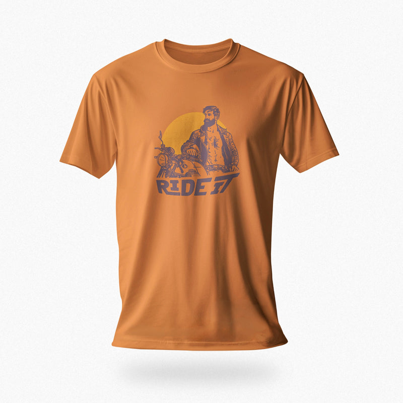 PRODUCT IMAGE of an orange t-shirt with a graphic featuring a rugged, bearded biker in a distressed vintage print style with the design's namesake, "Ride It."