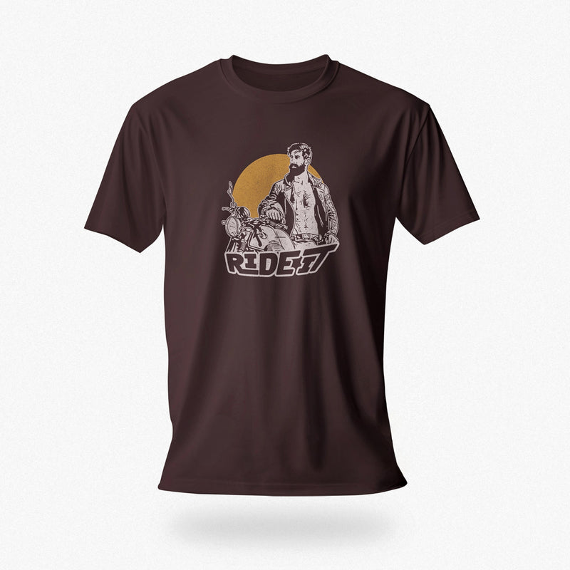 PRODUCT IMAGE of an Oxblood t-shirt with a graphic featuring a rugged, bearded biker in a distressed vintage print style with the design's namesake, "Ride It."