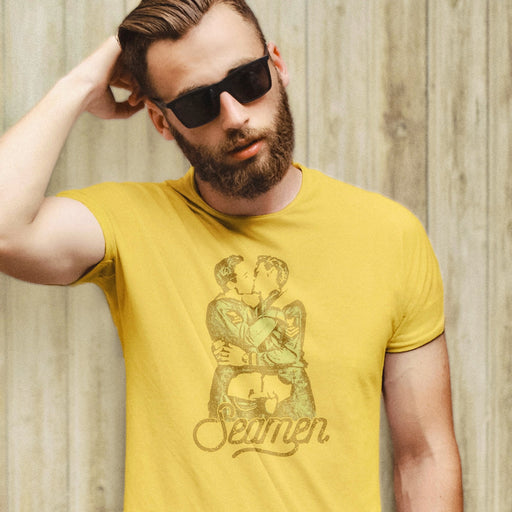 PRODUCT IMAGE: Seamen | Seamen T-shirt | Raunchy T-shirts Play on Word "Semen" | Model wears lyellowr shirt | Modeled from a vintage photo of two gay male sailors kissing. Seamen is a homonym, playing on the word — yep, you guessed it — semen. 