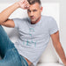 PRODUCT IMAGE: Muscle Daddy | Homo Erotic T-shirt | Masculine Tom of Finland Hottie | Graphic shadows of a classically handsome hot man | Model wears Light Blue shirt