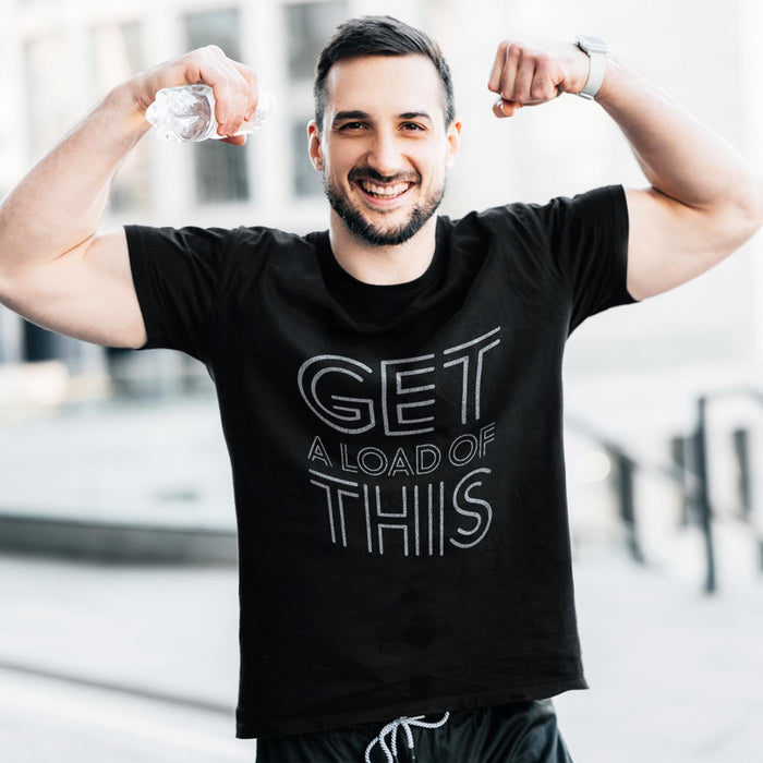 PRODUCT IMAGE: Get a Load of This | Raunchy Tee | Horny Gay Top Guys Ready to Unload | Model wears Black tee with typographic design 