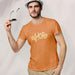 PRODUCT IMAGE: Whore | Offensive NSFW T-shirt for Horny Gay Guys | Typographic Design | model w/ orange shirt